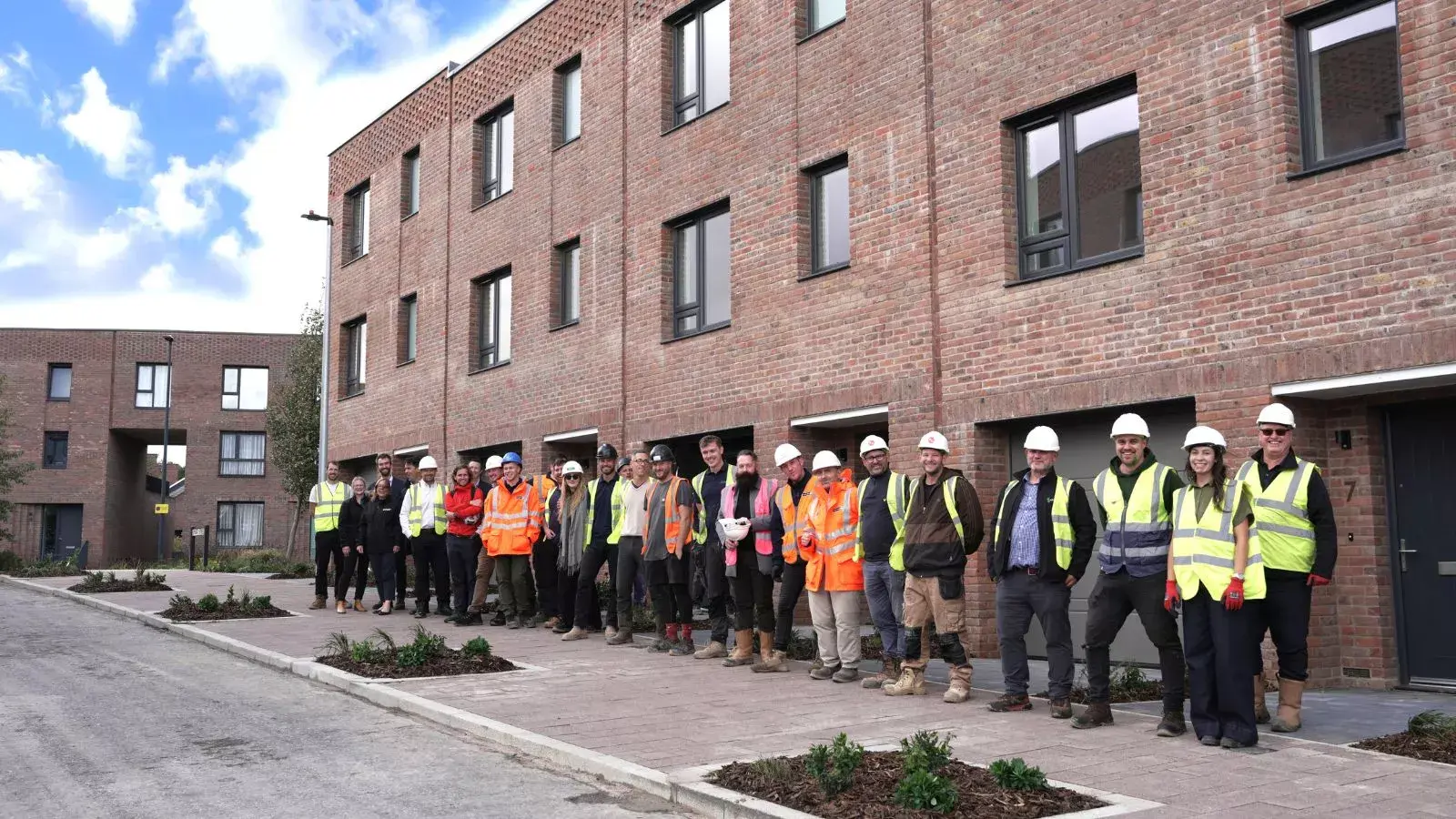 Soverign Handover At Brabazon YTL Developments, YTL Construction and SNG stand outside affordable housing on Smart Street at Brabazon in North Bristol.